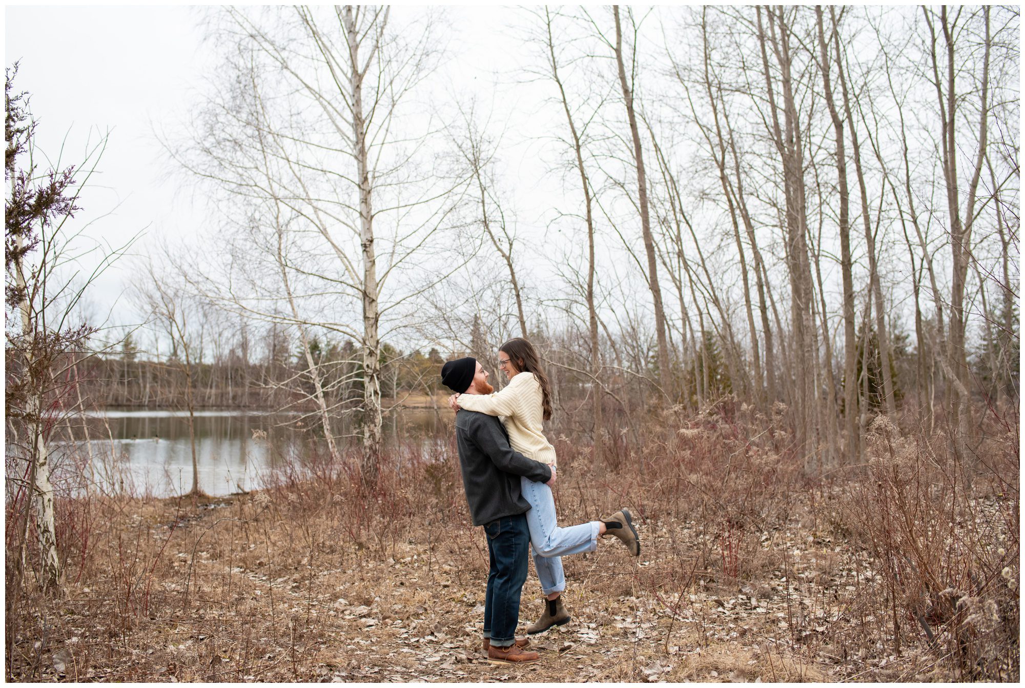 Man lifting woman smiling at each other at Pinafore Park in St Thomas Ontario.